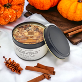 Pumpkin Spice Candle in a black aluminum tin. Wood Wick topped with cinnamon and cloves.